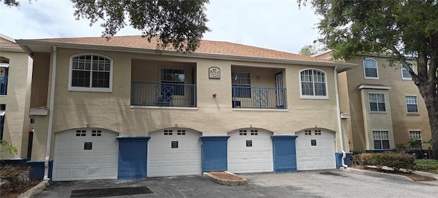 7220 Westpointe Blvd Unit 1429, Orlando, FL 32835 - townhome / multi-family property with a garage and stucco siding