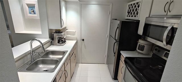 7220 Westpointe Blvd Unit 1429, Orlando, FL 32835 - kitchen with stainless steel appliances, light countertops, and light tile patterned flooring