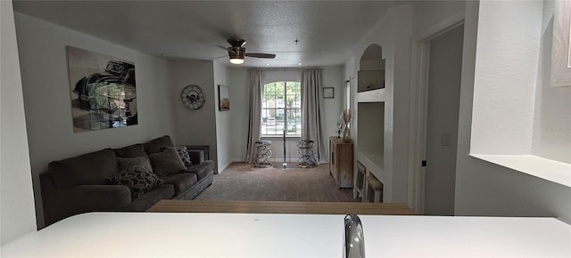 7220 Westpointe Blvd Unit 1429, Orlando, FL 32835 - living area featuring carpet, ceiling fan, and a fireplace