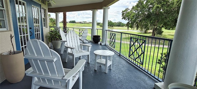 7220 Westpointe Blvd Unit 1429, Orlando, FL 32835 - balcony with french doors and a water view