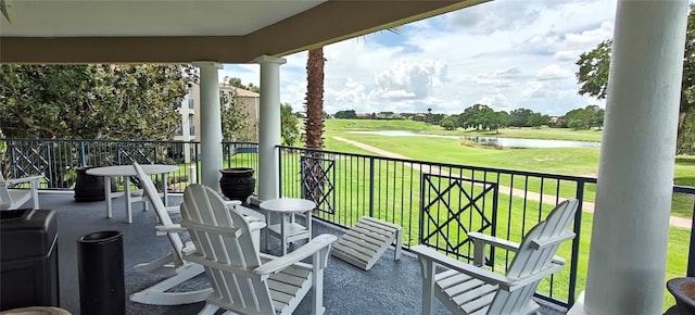 7220 Westpointe Blvd Unit 1429, Orlando, FL 32835 - balcony with view of golf course and a water view
