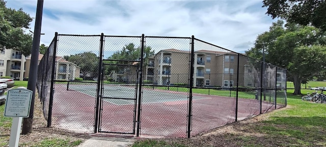 7220 Westpointe Blvd Unit 1429, Orlando, FL 32835 - view of tennis court featuring a gate