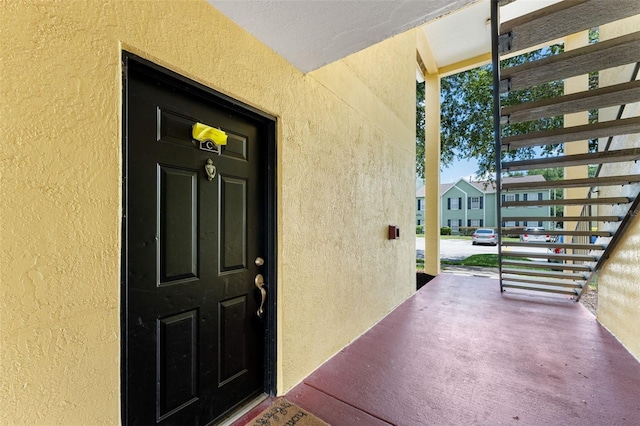 2041 Dixie Belle Dr Unit 2041C, Orlando, FL 32812 - doorway to property with stucco siding