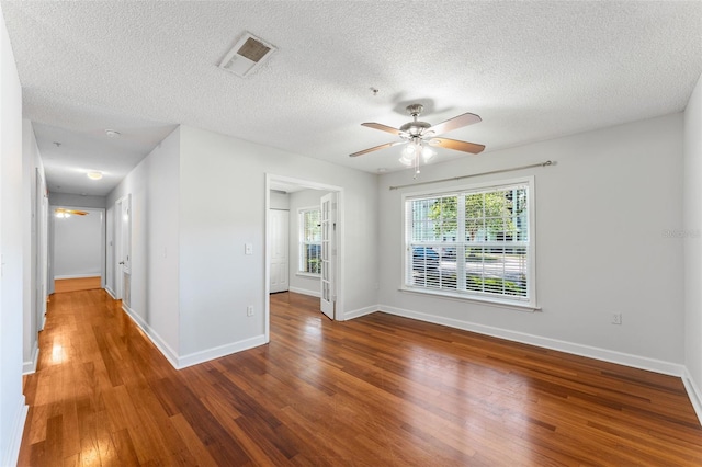 2041 Dixie Belle Dr Unit 2041C, Orlando, FL 32812 - spare room featuring a ceiling fan, wood finished floors, and a textured ceiling