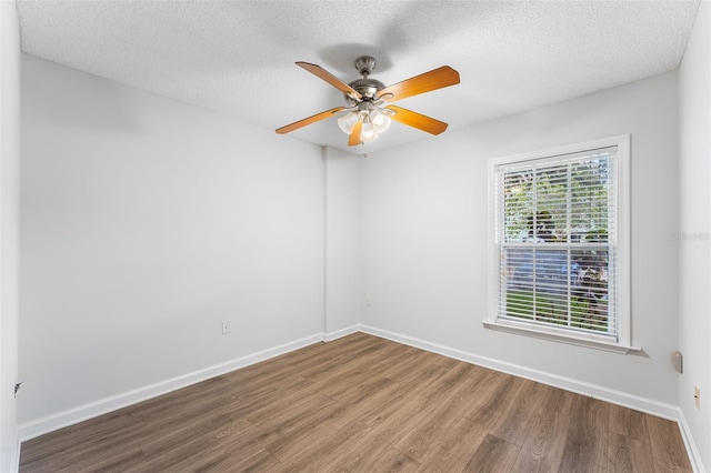 2041 Dixie Belle Dr Unit 2041C, Orlando, FL 32812 - unfurnished room with wood finished floors, a textured ceiling, and ceiling fan