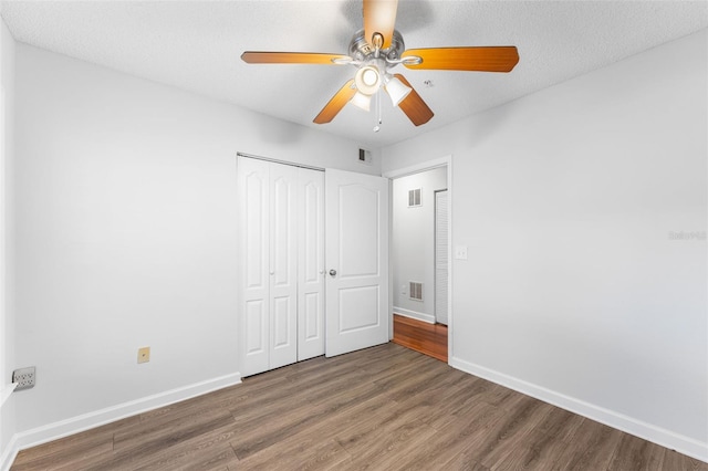 2041 Dixie Belle Dr Unit 2041C, Orlando, FL 32812 - unfurnished bedroom with wood finished floors, a closet, and a ceiling fan