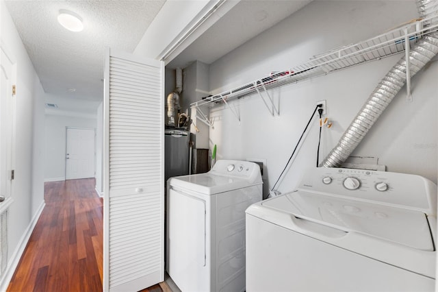 2041 Dixie Belle Dr Unit 2041C, Orlando, FL 32812 - washroom with washing machine and dryer and wood finished floors