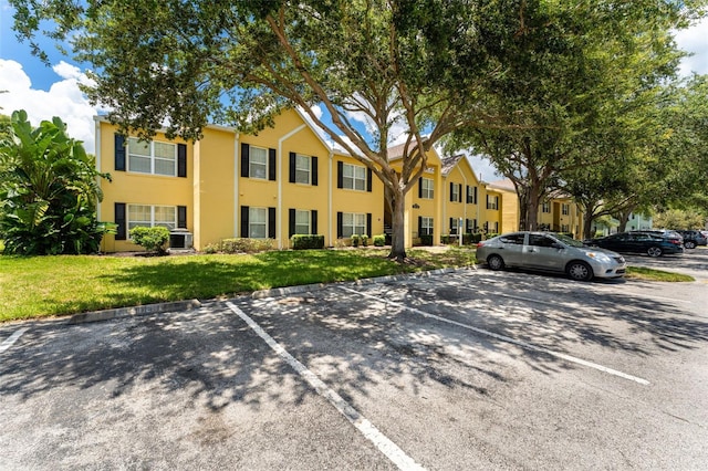2041 Dixie Belle Dr Unit 2041C, Orlando, FL 32812 - view of property with uncovered parking
