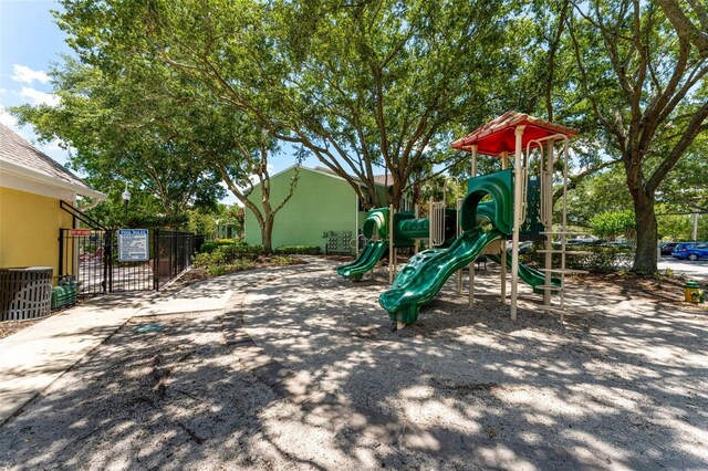 2041 Dixie Belle Dr Unit 2041C, Orlando, FL 32812 - community play area with a gate