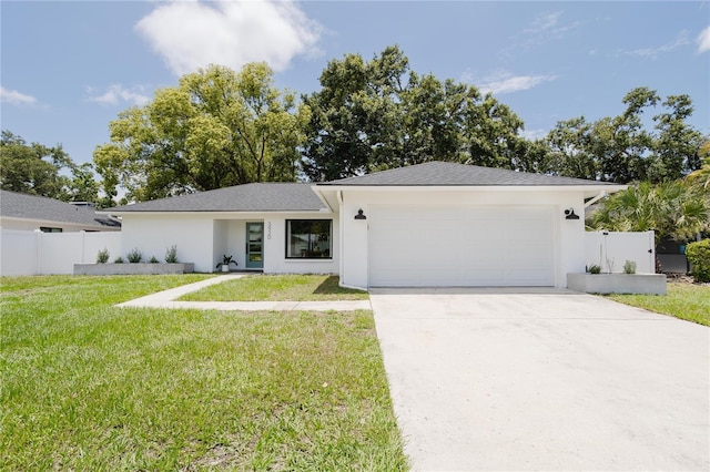 3920 Basswood Dr, Sarasota, FL 34232 - view of front of property featuring an attached garage, stucco siding, and driveway