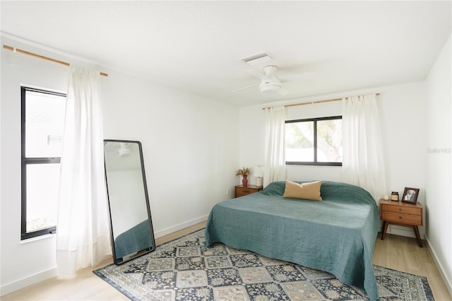 3920 Basswood Dr, Sarasota, FL 34232 - bedroom with light wood-style floors and ceiling fan