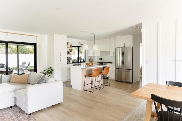 3920 Basswood Dr, Sarasota, FL 34232 - living area with light wood finished floors