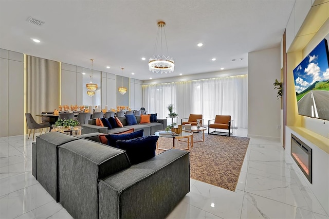 4429 Ganesha Loop, Kissimmee, FL 34746 - living room with light marble finish floors, a chandelier, and recessed lighting