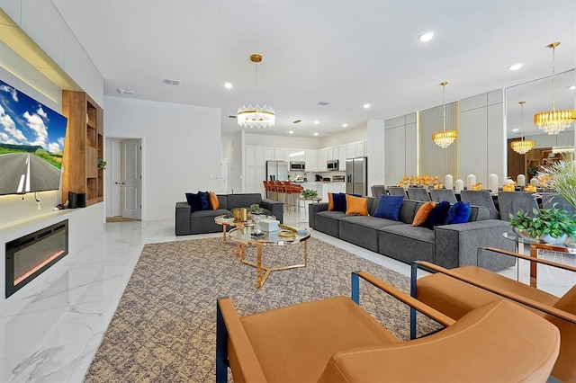 4429 Ganesha Loop, Kissimmee, FL 34746 - living area with a chandelier, light marble finish flooring, and recessed lighting