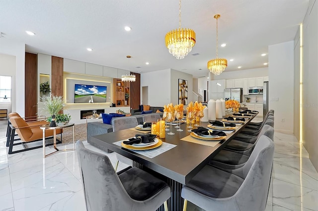4429 Ganesha Loop, Kissimmee, FL 34746 - dining area featuring a chandelier, light marble finish floors, and recessed lighting