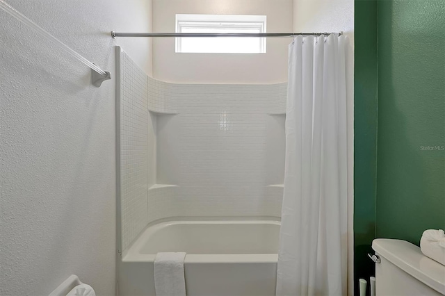 4429 Ganesha Loop, Kissimmee, FL 34746 - full bathroom with shower / tub combo with curtain and a textured wall