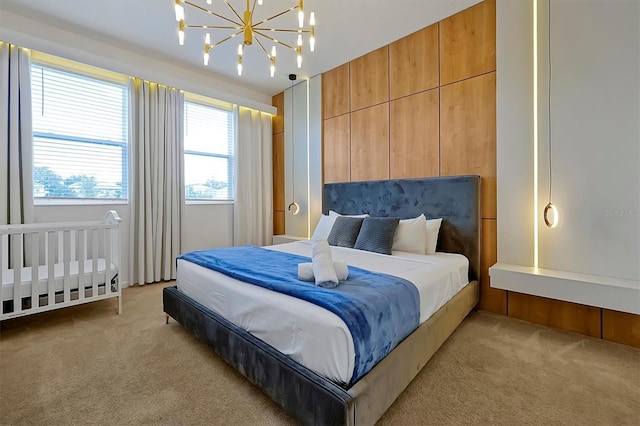 4429 Ganesha Loop, Kissimmee, FL 34746 - bedroom featuring light colored carpet and a chandelier