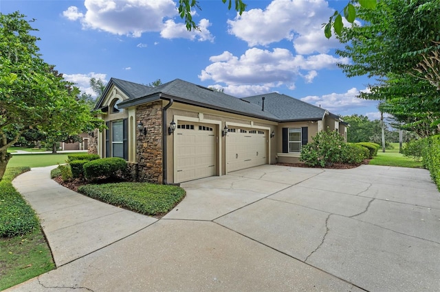 1224 Northern Way, Winter Springs, FL 32708 - view of side of property with stone siding, a garage, driveway, roof with shingles, and stucco siding