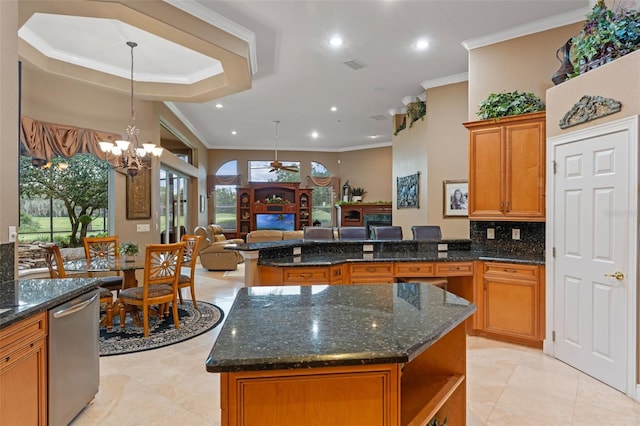 1224 Northern Way, Winter Springs, FL 32708 - kitchen featuring stainless steel dishwasher, a fireplace, open floor plan, brown cabinets, and crown molding