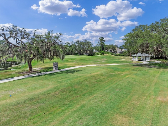 1224 Northern Way, Winter Springs, FL 32708 - view of community featuring a yard, view of golf course, and view of wooded area
