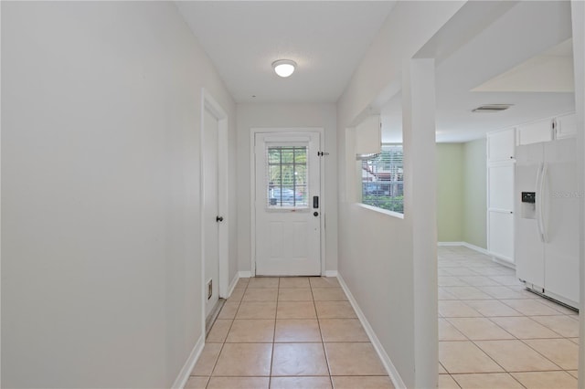 1026 Mccully Ct, Oviedo, FL 32765 - entryway with light tile patterned floors and baseboards