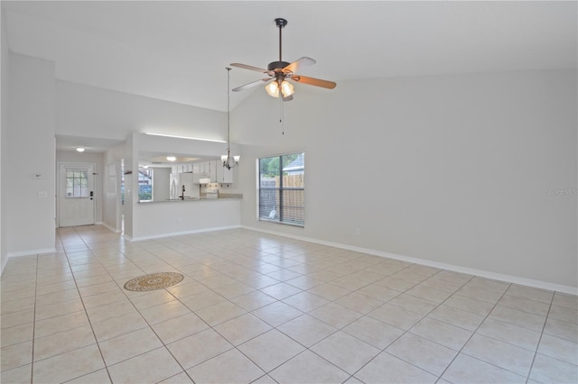 1026 Mccully Ct, Oviedo, FL 32765 - unfurnished living room featuring light tile patterned flooring, a ceiling fan, healthy amount of natural light, and high vaulted ceiling
