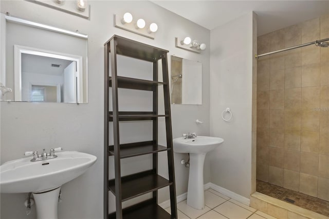 1026 Mccully Ct, Oviedo, FL 32765 - bathroom with a tile shower and tile patterned flooring