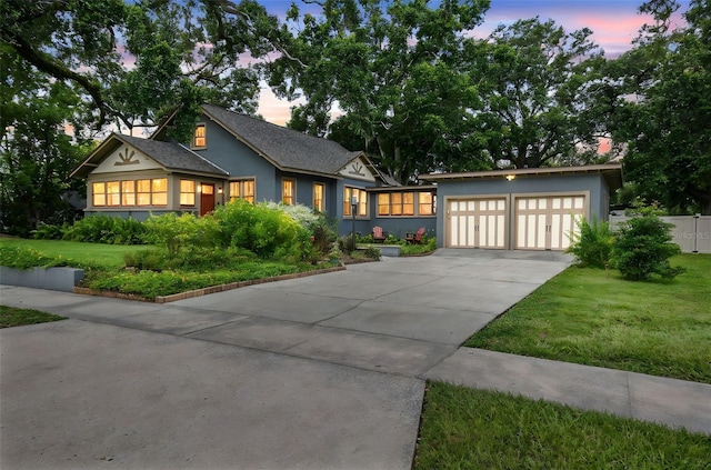 524 S Lakeview Ave, Winter Garden, FL 34787 - view of front of home featuring driveway, a lawn, stucco siding, and an attached garage