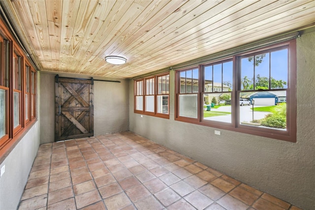 524 S Lakeview Ave, Winter Garden, FL 34787 - unfurnished sunroom with a barn door and plenty of natural light