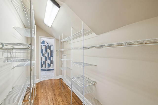 524 S Lakeview Ave, Winter Garden, FL 34787 - walk in closet featuring wood finished floors and lofted ceiling