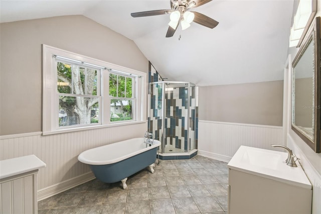 524 S Lakeview Ave, Winter Garden, FL 34787 - bathroom featuring wainscoting, vanity, vaulted ceiling, a freestanding tub, and a shower stall