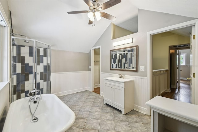 524 S Lakeview Ave, Winter Garden, FL 34787 - full bathroom featuring wainscoting, lofted ceiling, a freestanding bath, a ceiling fan, and vanity