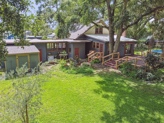 524 S Lakeview Ave, Winter Garden, FL 34787 - back of property with a deck, a yard, and stucco siding