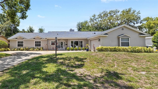2220 Derbyshire Rd, Maitland, FL 32751 - ranch-style house with a garage, a front lawn, and a chimney
