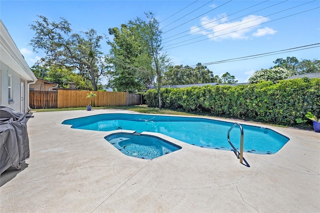 2220 Derbyshire Rd, Maitland, FL 32751 - view of swimming pool featuring a fenced backyard, a patio, and a pool with connected hot tub
