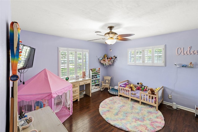 2220 Derbyshire Rd, Maitland, FL 32751 - bedroom with multiple windows, wood finished floors, and a ceiling fan