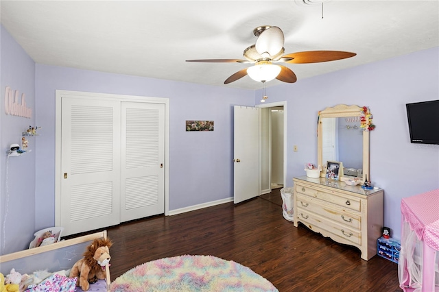 2220 Derbyshire Rd, Maitland, FL 32751 - bedroom with a closet, wood finished floors, and a ceiling fan