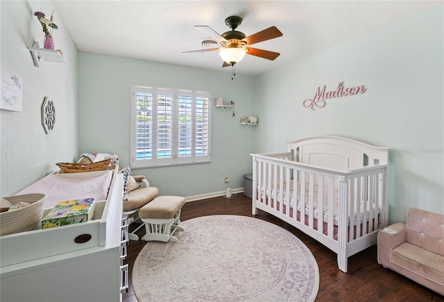 2220 Derbyshire Rd, Maitland, FL 32751 - bedroom featuring a nursery area, wood finished floors, and ceiling fan