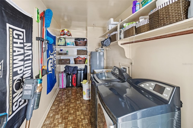 2220 Derbyshire Rd, Maitland, FL 32751 - washroom with separate washer and dryer, water heater, and tile patterned floors