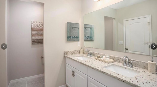 305 Cadence Gln SW, Lake City, FL 32024 - bathroom featuring double vanity and tile patterned floors