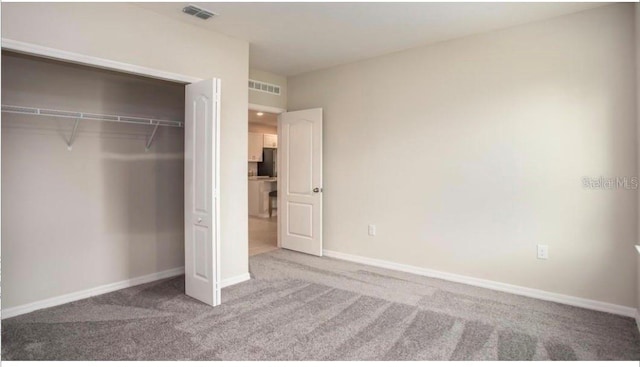 305 Cadence Gln SW, Lake City, FL 32024 - unfurnished bedroom featuring carpet flooring and a closet