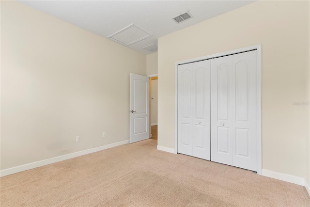 7409 Fairgrove Ave, Windermere, FL 34786 - unfurnished bedroom with carpet, attic access, and a closet