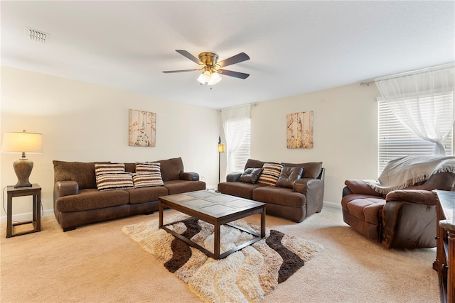 7409 Fairgrove Ave, Windermere, FL 34786 - living area with light colored carpet and ceiling fan
