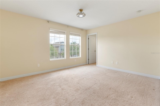 7409 Fairgrove Ave, Windermere, FL 34786 - unfurnished room with light carpet and a smoke detector