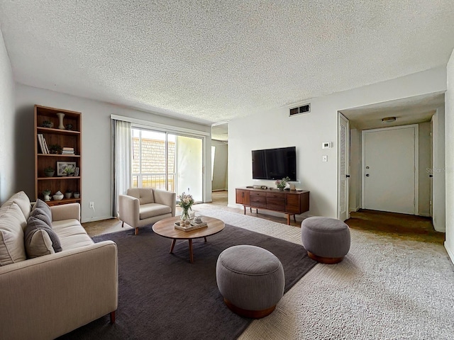 200 St Andrews Blvd Unit 911, Winter Park, FL 32792 - carpeted living area with a textured ceiling