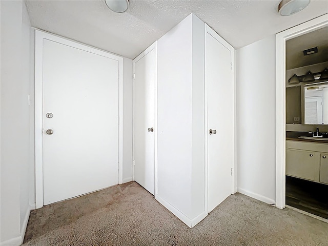 200 St Andrews Blvd Unit 911, Winter Park, FL 32792 - hallway with light carpet and a textured ceiling