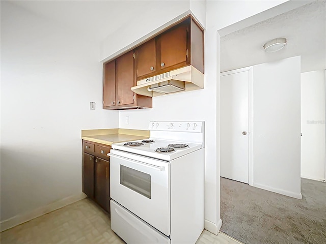 200 St Andrews Blvd Unit 911, Winter Park, FL 32792 - kitchen featuring white range with electric stovetop, under cabinet range hood, and light countertops
