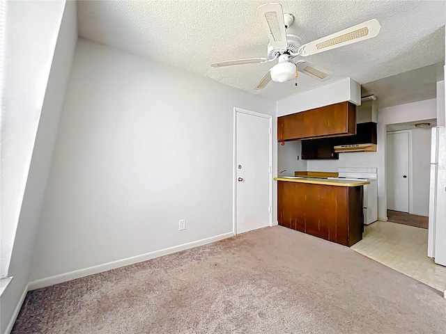 200 St Andrews Blvd Unit 911, Winter Park, FL 32792 - kitchen featuring brown cabinetry, a ceiling fan, white appliances, a textured ceiling, and light carpet