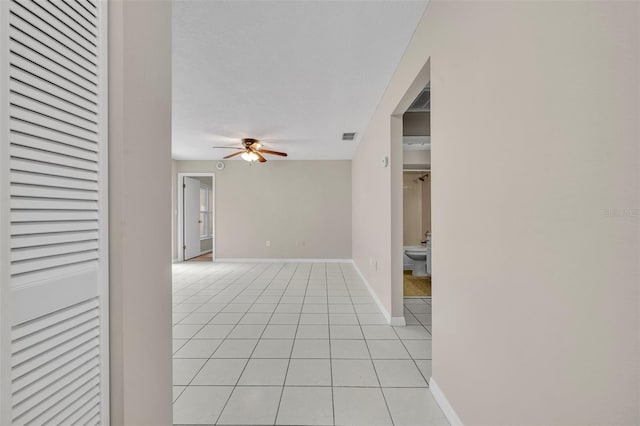 557 Hunter Cir, Kissimmee, FL 34758 - spare room with ceiling fan and light tile patterned floors