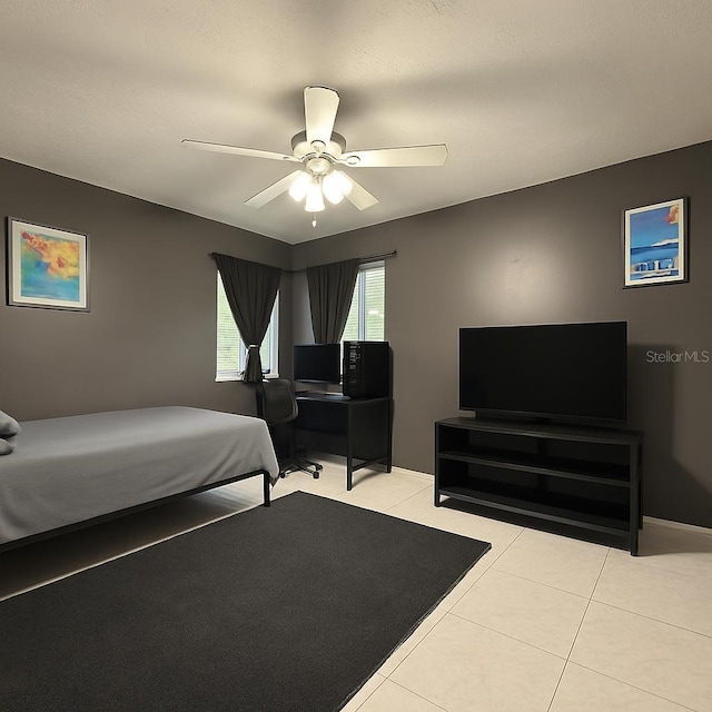 831 Fletcher Rd SE, Palm Bay, FL 32909 - bedroom featuring light tile patterned flooring and a ceiling fan